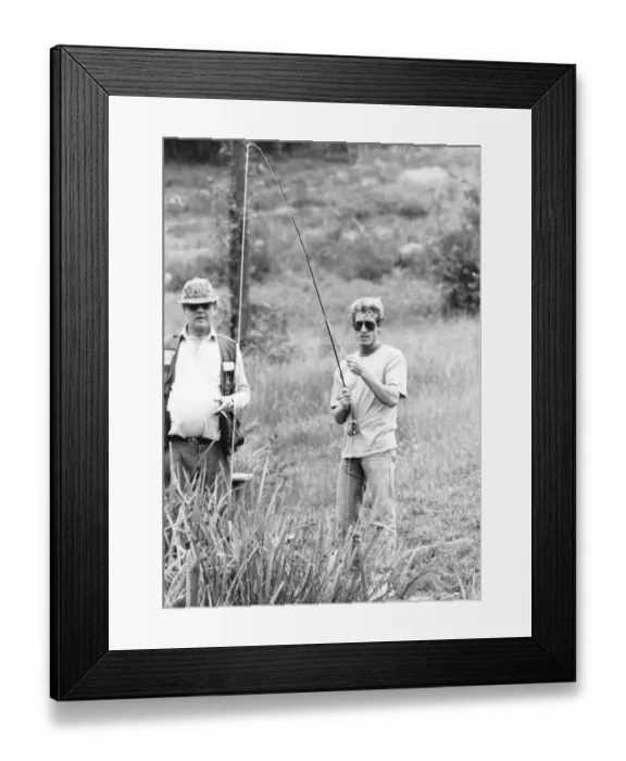 Framed Print : Roger Daltrey lead singer of The Who fishing with Alan Pearson world record holder