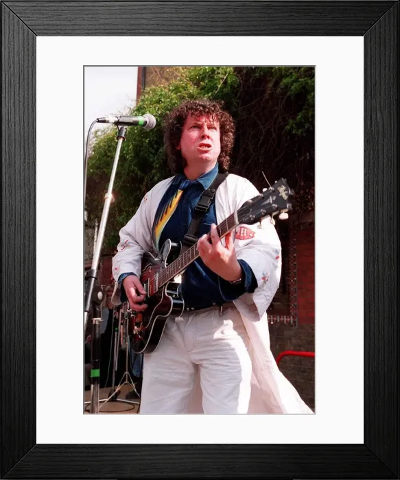 Framed Print : Paul Bradley actor from Eastenders playing the guitar with his group the hkippers