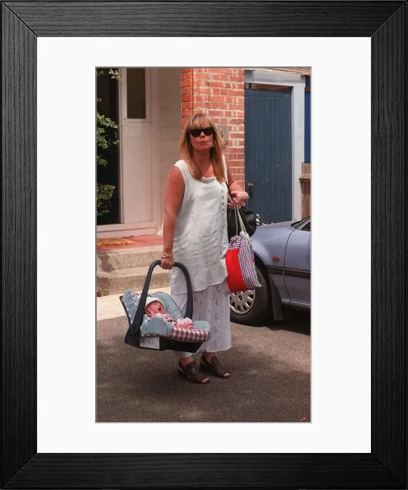 Framed Print : Linda Robson actress poses with her new baby today Framed Print : Linda Robson actress poses with her new baby today
