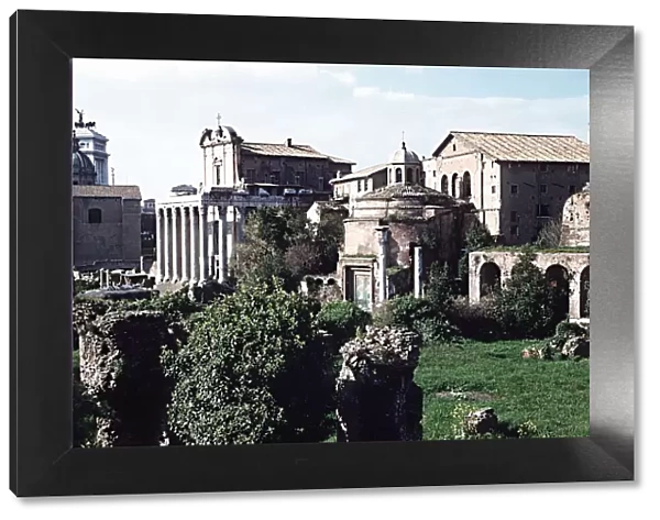 Ruins of the Temple of Antoninus and Faustina with Temple of Romulus on right Rome Italy