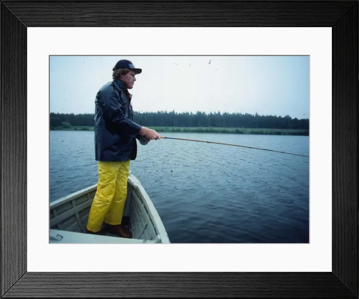 Framed Print : Andy Bean golfer August 1978 Standing in rowing boat fishing angling waterproofs Framed Print : Andy Bean golfer August 1978 Standing in rowing boat fishing angling waterproofs