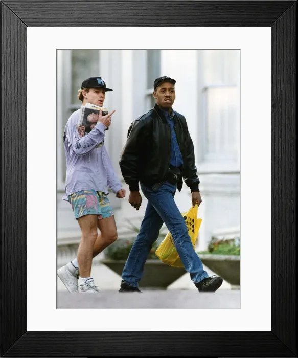 Framed Print : Jason Donovan Actor  /  Singer walking along with minder Barrie Knight