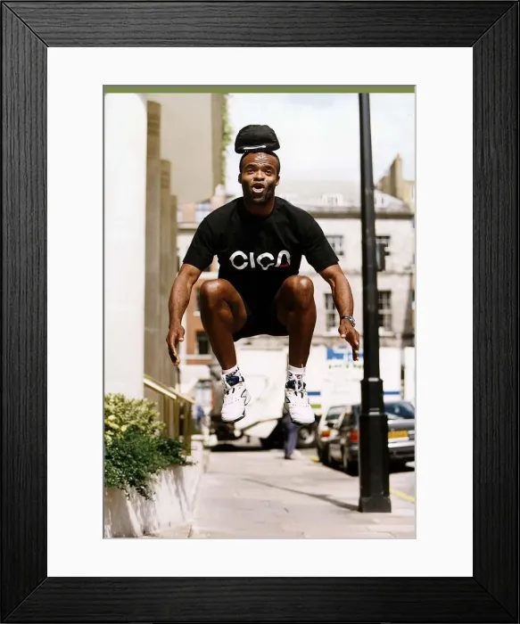 Framed Print : Kriss Akabussi athlete leaps in the air