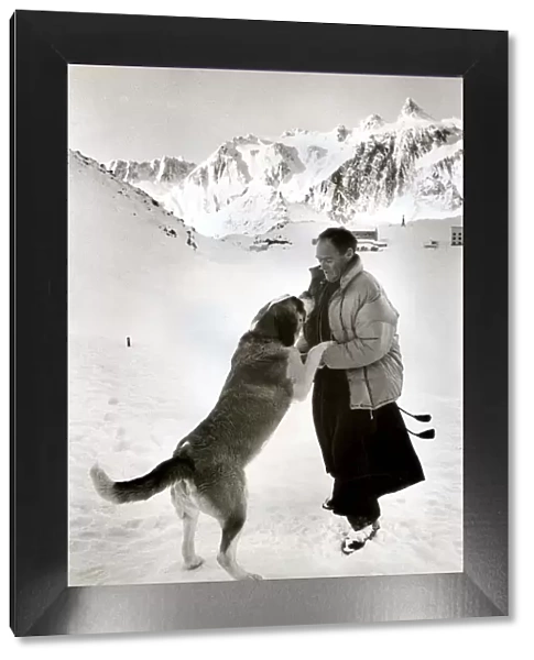 Father Bernard with Seine the St Bernand dog at St. Bernard Pass in Switzerland