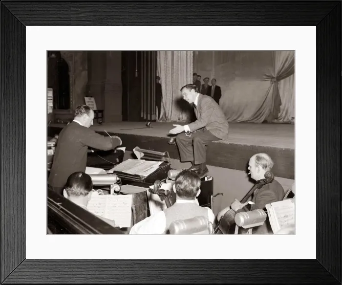 Framed Print : American singer and film star Frank Sinatra sitting on stage during rehearsals Framed Print : American singer and film star Frank Sinatra sitting on stage during rehearsals