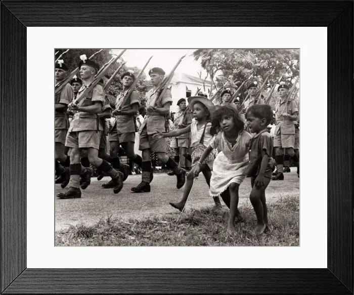 Framed Print : British soldiers marching in Georgetown British Guiana followed by some children in 1953
