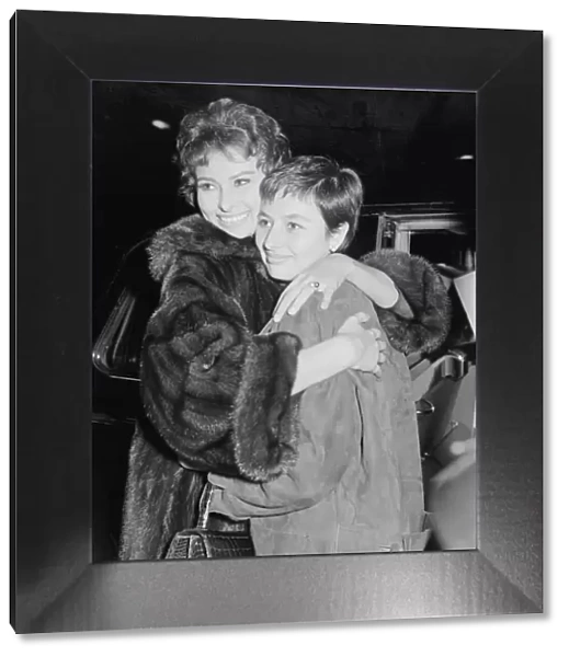 Sophia Loren at London Airport with her sister Maria. Maria had just arrived from Italy