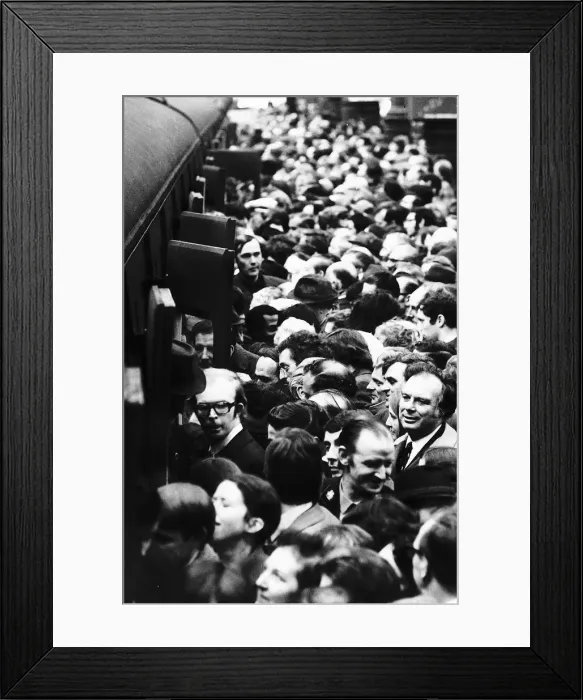 Framed Print : Commuters on a crowded London main line staion try to board a train Framed Print : Commuters on a crowded London main line staion try to board a train