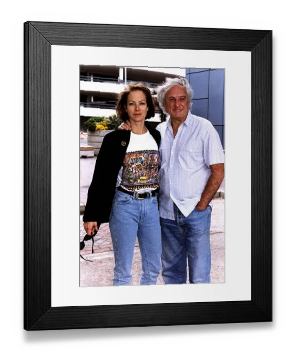 Framed Print : Michael Winner Film Director with actress girlfriend Jenny Seagrove at Heathrow airport