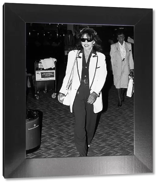 British actress Joan Collins arrives at Heathrow Airport