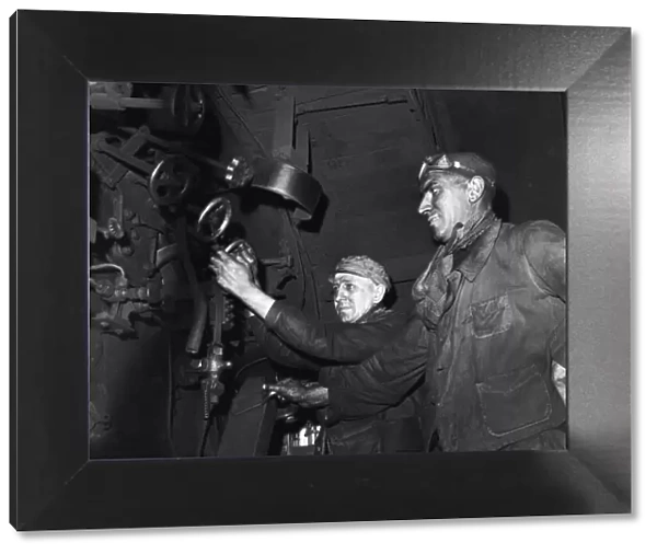 Alfred Demaszure (Left) engine driver and Andre Devos, fireman seen here on the footplate
