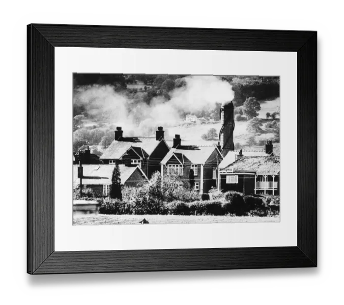 Framed Print : Pollution caused from smoke fumes pouring from the chimney of a Re Chem chemical
