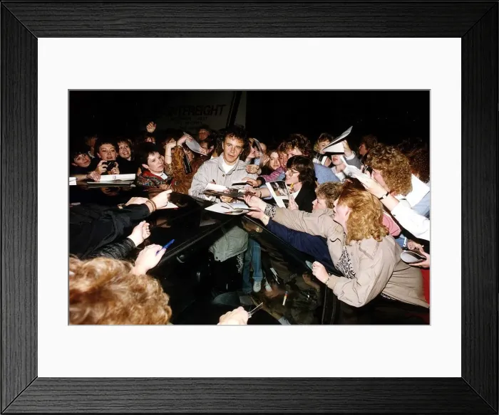 Framed Print : David Essex Singer Actor singing autographs as fans crowd him outside his car