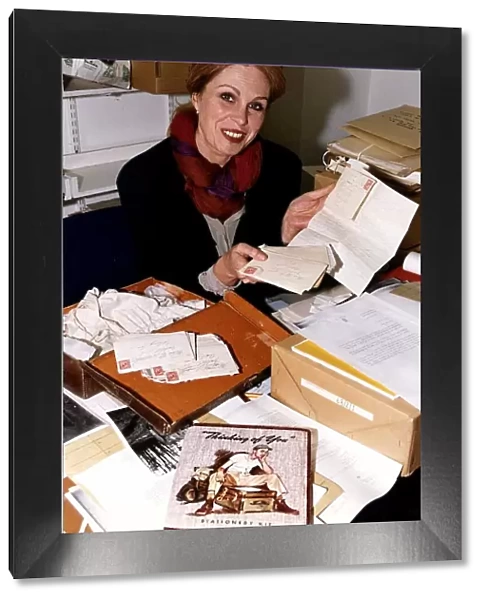 Joanna Lumley actress at the Imperial War Museum holding some letters from soldiers