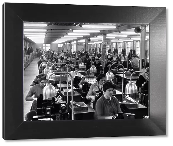 General picture of a Civil service office where girls operate machines that record names