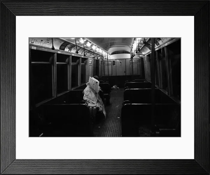 Framed Print : A limited service is ran on a underground strike day. This commuter is the only person Framed Print : A limited service is ran on a underground strike day. This commuter is the only person