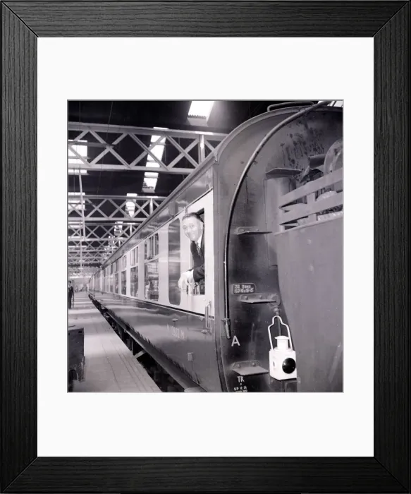 Framed Print : A passenger awaits the depature of his train from Euston Station July 1955 Framed Print : A passenger awaits the depature of his train from Euston Station July 1955