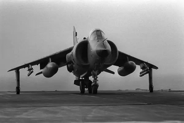 A Fleet Air Arm Sea Harrier prepares to take off from the flight deck of HMS Invincible
