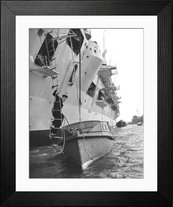 Framed Print : Leading Seaman Philip Benjamin climbs down a rope ladder from HMS Eagle to an awaiting Framed Print : Leading Seaman Philip Benjamin climbs down a rope ladder from HMS Eagle to an awaiting