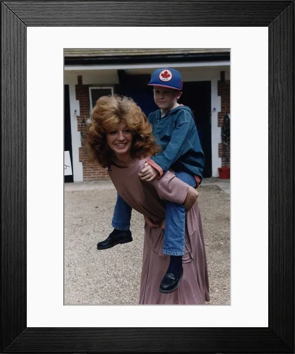 Framed Print : Rula Lenska British Actress Founder trustee of Angels International carrying her nephew