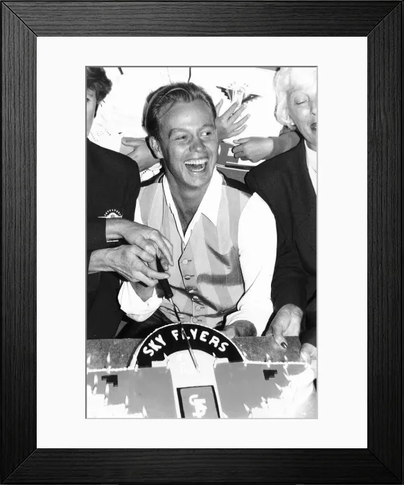 Framed Print : Jason Donovan actor and singer cuts a cake at Gatwick Airport to mark the 21st