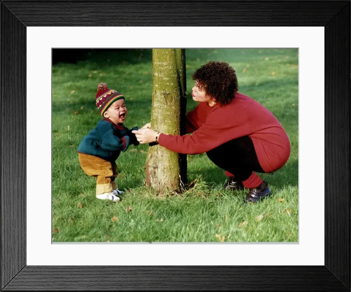 Framed Print : Cheryl Maiker actress playing with her baby son Benjamin Framed Print : Cheryl Maiker actress playing with her baby son Benjamin