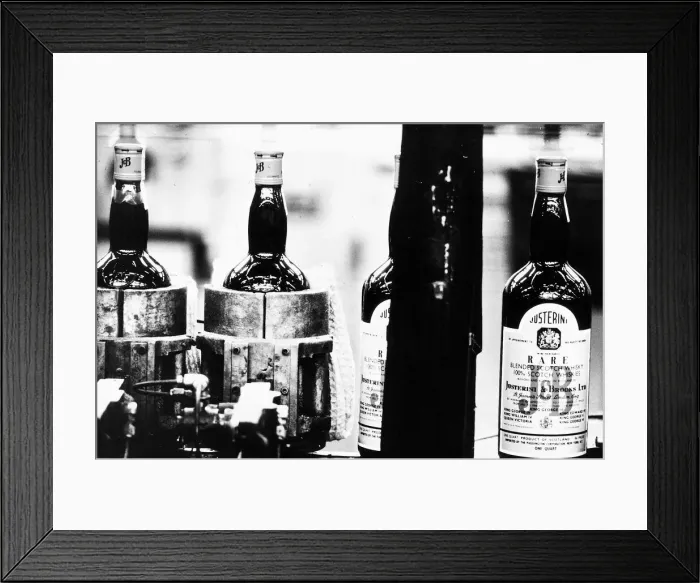 Framed Print : New bottles of whisky on the production line at a Whisky bottling plant 1971 Framed Print : New bottles of whisky on the production line at a Whisky bottling plant 1971