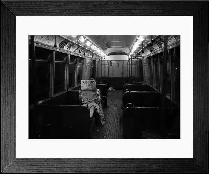Framed Print : A limited service is ran on a underground strike day. This commuter is the only person Framed Print : A limited service is ran on a underground strike day. This commuter is the only person