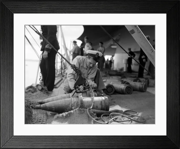 Framed Print : The crew of the County Class cruiser HMS London taking on board supplies Framed Print : The crew of the County Class cruiser HMS London taking on board supplies