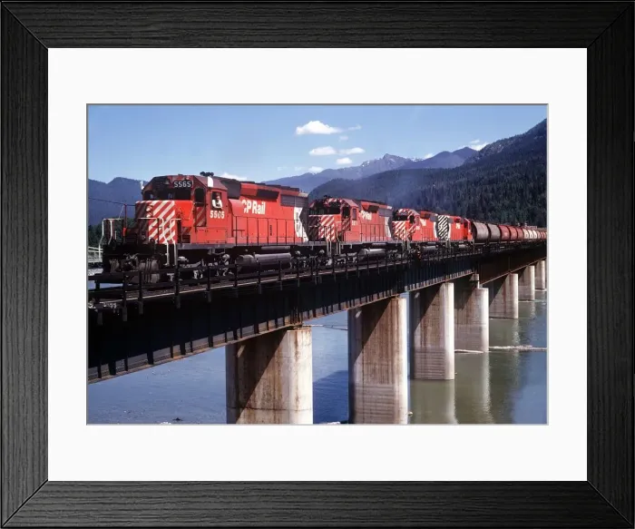 Framed Print : Revelstoke British Columbia Canada Freight train pulled by four diesel engines