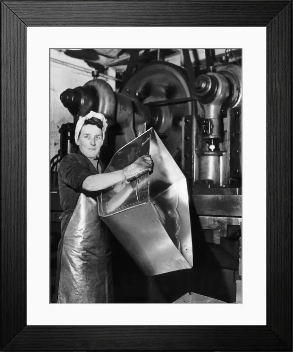 Framed Print : Lily Hill at her giant press stamping out the metal foundations of baby prams at a Framed Print : Lily Hill at her giant press stamping out the metal foundations of baby prams at a