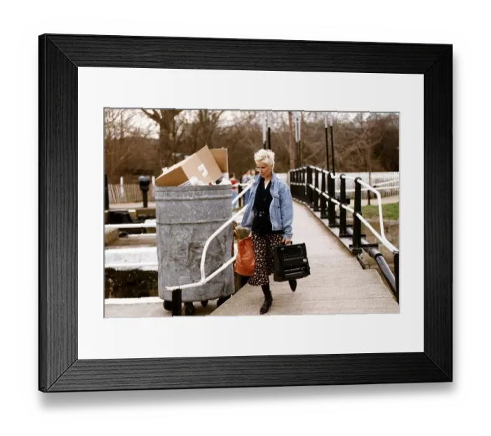 Framed Print : Paula Yates TV Presenter Walking over bridge with holding typewriter Framed Print : Paula Yates TV Presenter Walking over bridge with holding typewriter