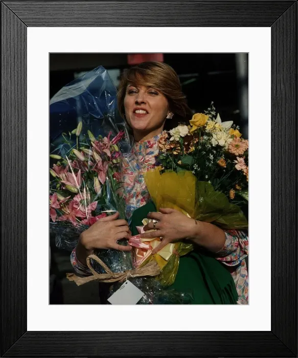 Framed Print : Anne Diamond TV Presenter Holding flowers Framed Print : Anne Diamond TV Presenter Holding flowers