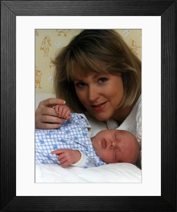 Framed Print : Kathryn Holloway TV Presenter of UK Livings Agony Programme with baby son James Holloway
