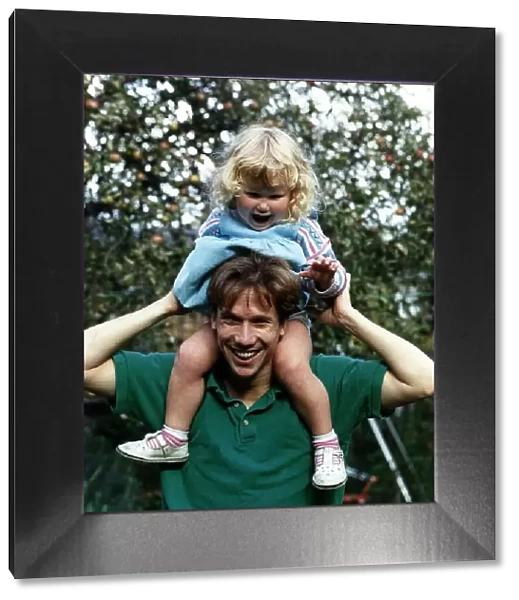 Peter Duncan TV Presenter with daughter on shoulders A©Mirrorpix