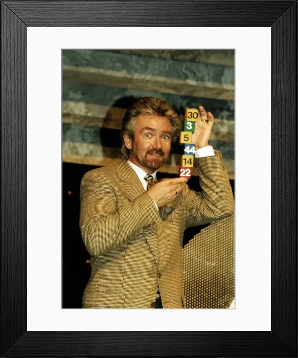 Framed Print : Noel Edmonds Tv Presenter with some National Lottery numbers Framed Print : Noel Edmonds Tv Presenter with some National Lottery numbers