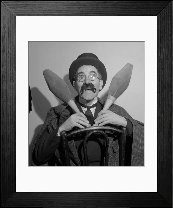 Framed Print : Comedian Eddie Gray seen here holding skittles wearing a false moustache Comic
