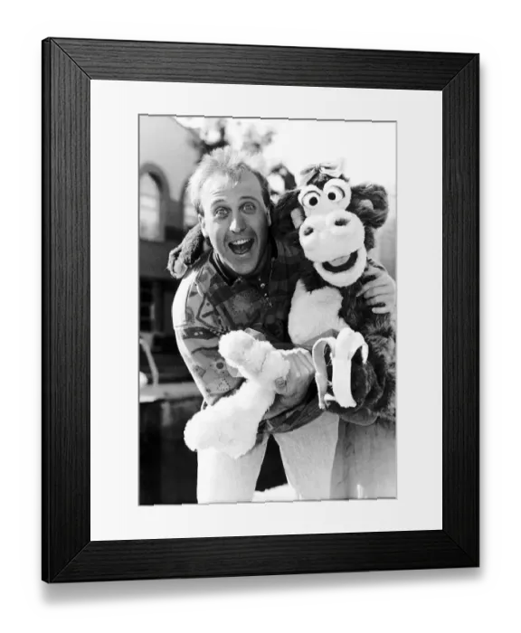 Framed Print : Mike Brosnan TV presenter with Chuck the Chimpanzee Framed Print : Mike Brosnan TV presenter with Chuck the Chimpanzee