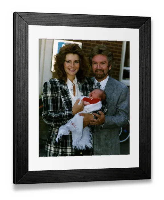 Framed Print : Noel Edmonds Tv Presenter with new born baby Olivia and wife Helen Framed Print : Noel Edmonds Tv Presenter with new born baby Olivia and wife Helen