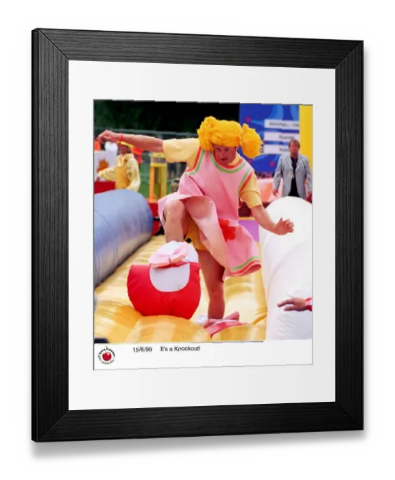 Framed Print : Contestants in the TV Programme Its A Knockout Aug 1999 wearing funny costumes playing Framed Print : Contestants in the TV Programme Its A Knockout Aug 1999 wearing funny costumes playing