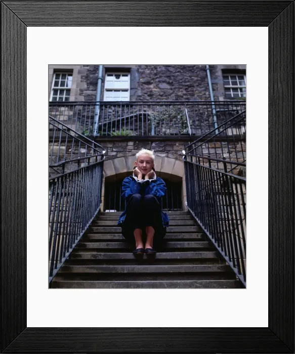 Framed Print : Muriel Gray TV presenter sitting on stairs steps Framed Print : Muriel Gray TV presenter sitting on stairs steps