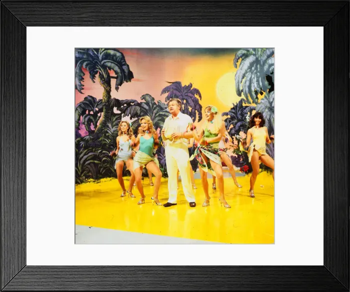 Framed Print : Benny Hill comedian 1989 With girls dancing on stage desert island palms trees set