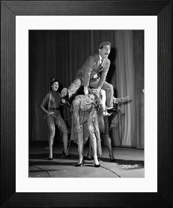Framed Print : Comedian Norman Wisdom with cast members of his pantomime The Wonderful Lamp 1956 Framed Print : Comedian Norman Wisdom with cast members of his pantomime The Wonderful Lamp 1956