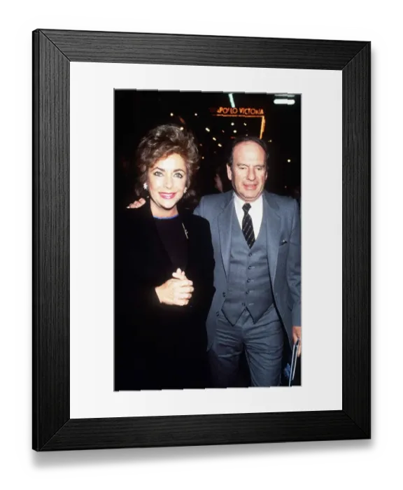 Framed Print : Elizabeth Taylor February 1985 with fiance Victor Lunaat at the new Apollo theatre