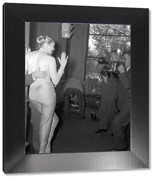 Comedian and actor Norman Wisdom poses for photographers with actress Anita Ekberg at