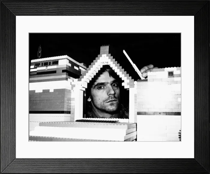 Framed Print : Jeremy Irons Actor with his head inside model house built from lego bricks which was used Framed Print : Jeremy Irons Actor with his head inside model house built from lego bricks which was used