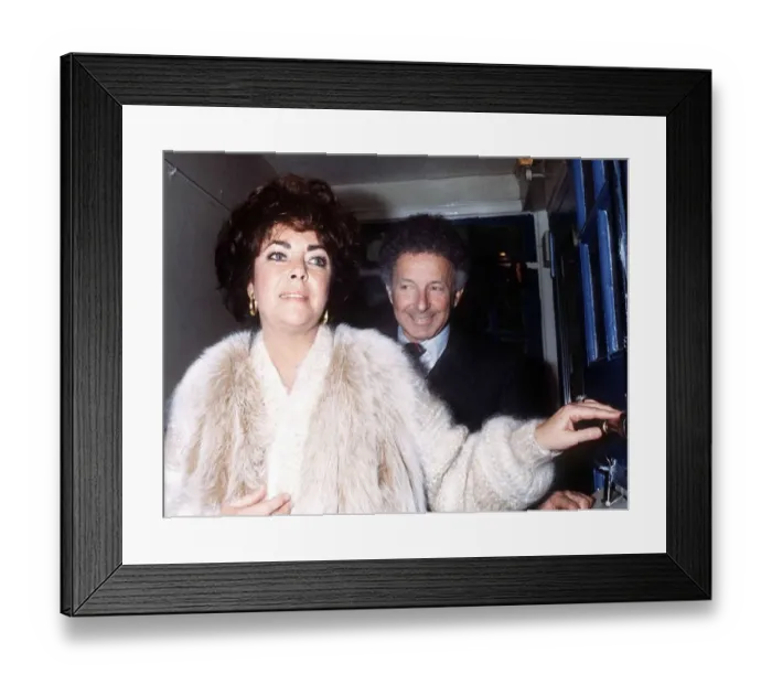 Framed Print : Elizabeth Taylor February 1982, wearing White Fur coat with Zev Bufman