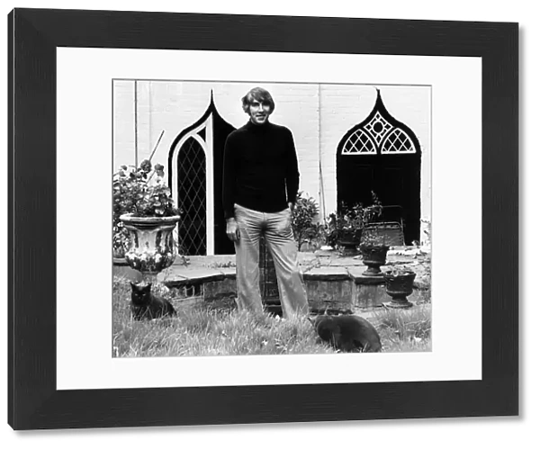 Peter Cook comedian actor outside house 1975