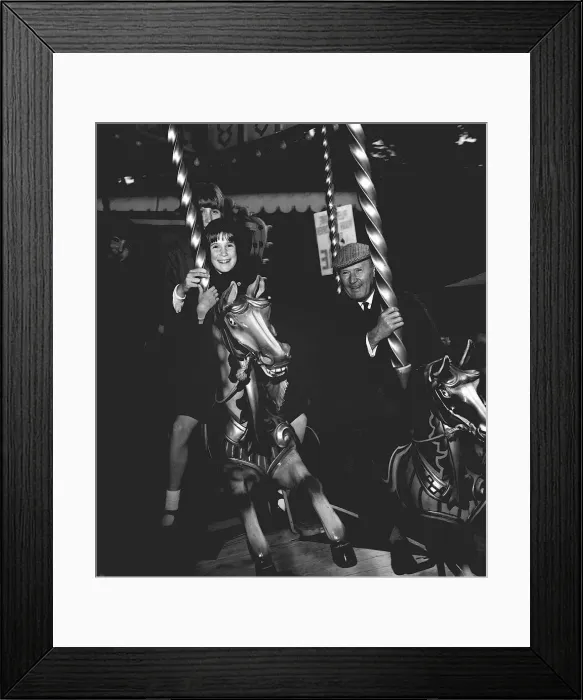 Framed Print : Raymond Francis with his daughters Francis and Caroline on the merry-go-round Framed Print : Raymond Francis with his daughters Francis and Caroline on the merry-go-round