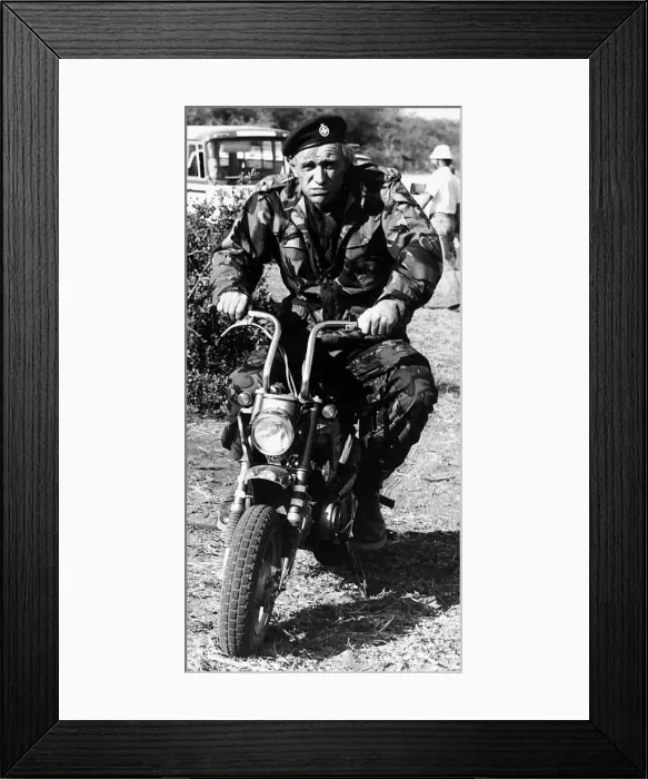 Framed Print : Richard Harris Irish actor on set of film Wild Geese 1977 riding motorcycle in army Framed Print : Richard Harris Irish actor on set of film Wild Geese 1977 riding motorcycle in army